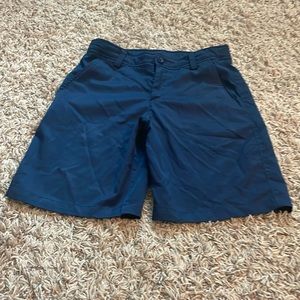 Boys Under Armour navy blue golf shorts. Size medium. Adjustable waistband.
